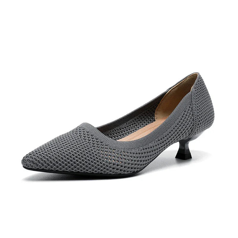 Grey knit pointed toe kitten heel shoe with low black heel on white background