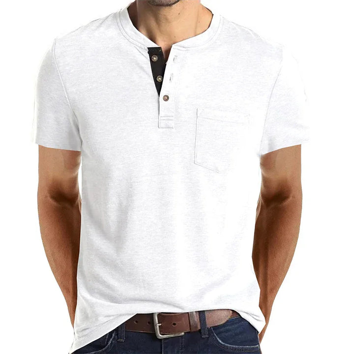 Men's white short-sleeve henley shirt with a buttoned placket and chest pocket, paired with jeans