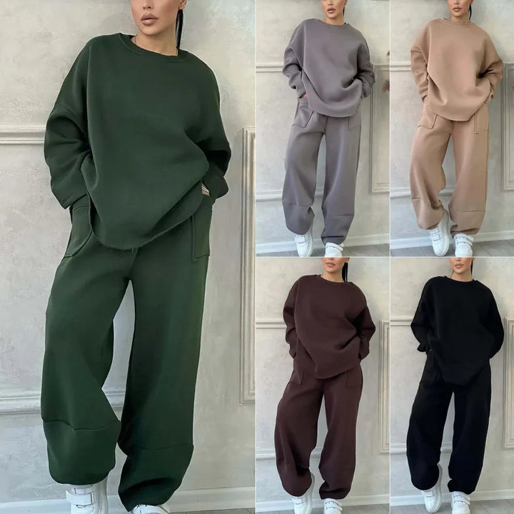 Women wearing cozy oversized sweatshirts and matching jogger pants in green, gray, beige, brown, and black colors