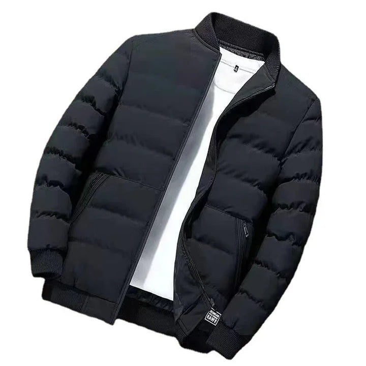 Black quilted bomber jacket with ribbed collar and cuffs over a white t-shirt on white background
