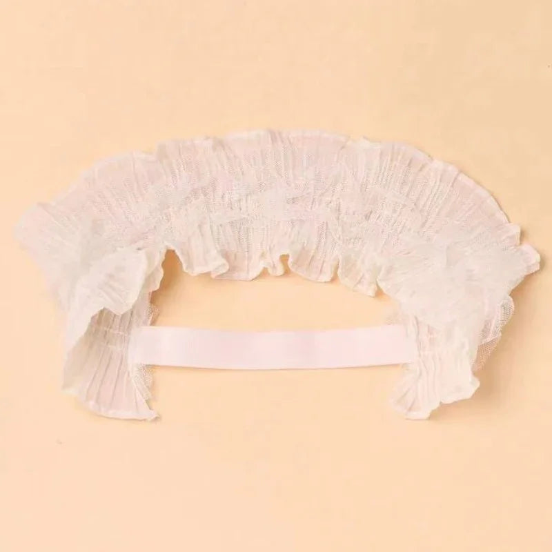 White ruffled lace collar with elastic band on beige background, vintage fashion accessory