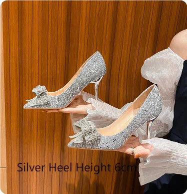 Silver glitter high heels with 6cm stiletto heels and decorative bow detail