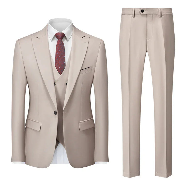 Beige men's formal suit set with blazer, vest, matching trousers, white shirt, and brown patterned tie