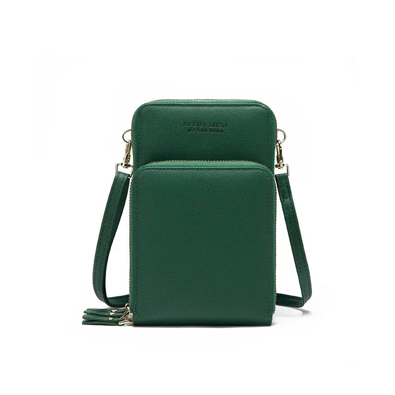 Green leather crossbody bag with two zippered compartments and adjustable strap