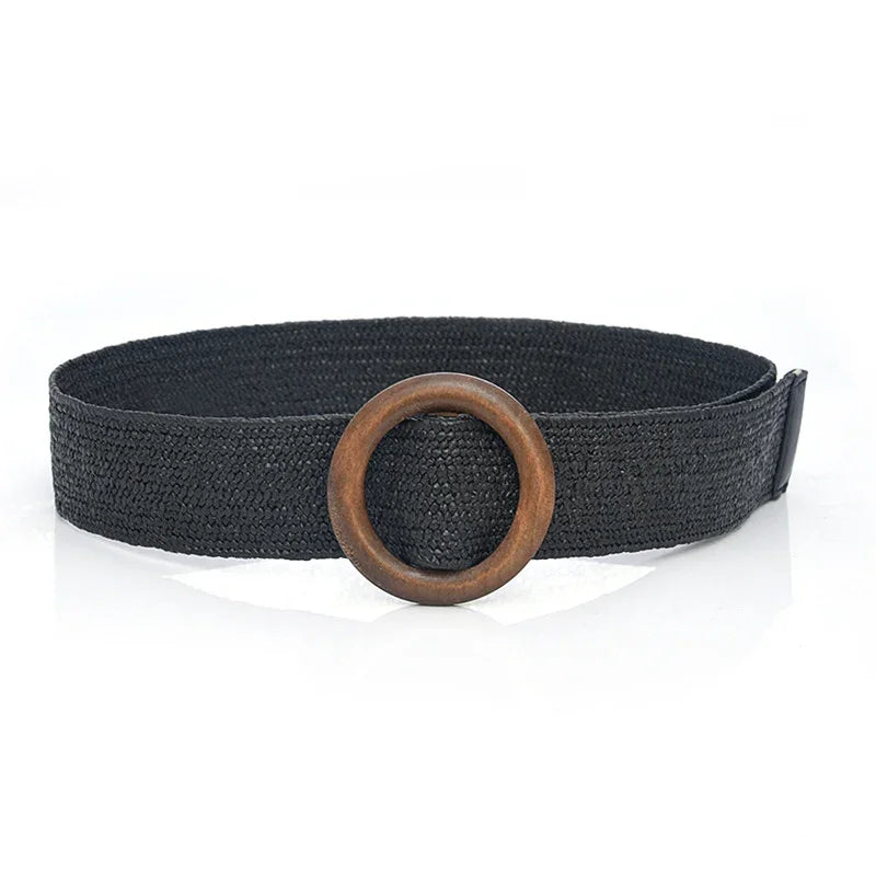Black woven belt with large round wooden buckle on white background