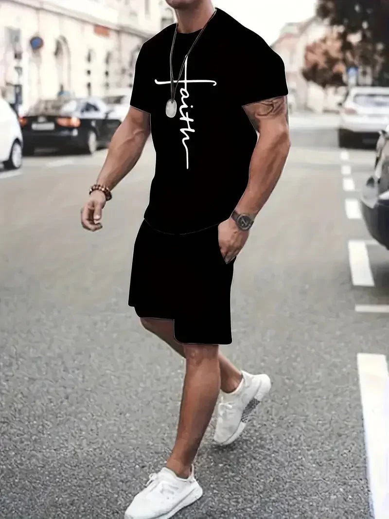 Man wearing black t-shirt with white faith cross print and black shorts walking on city street