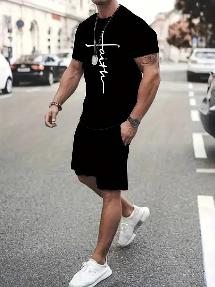 Man wearing black t-shirt with white faith cross print and black shorts walking on city street