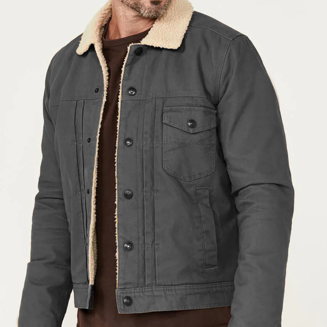 Men's charcoal gray jacket with beige sherpa collar and button-up front, worn over brown shirt