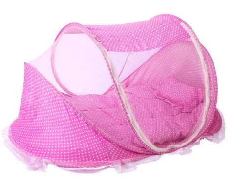 Pink polka dot baby mosquito net tent with cushioned base and mesh sides