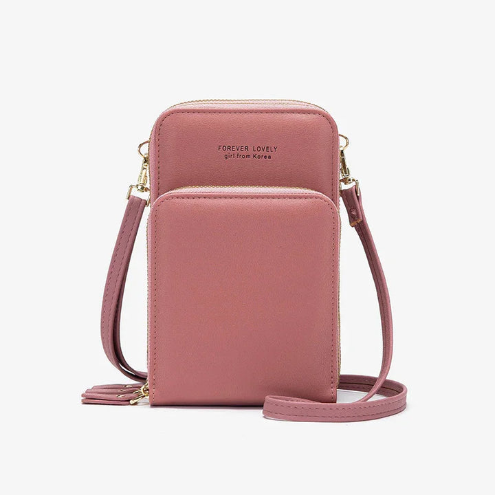 Pink crossbody bag with dual zippered compartments and gold hardware, labeled Forever Lovely