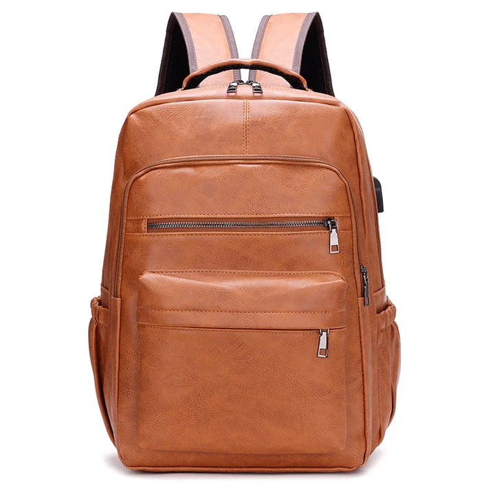 brown leather backpack with multiple zippered compartments and padded shoulder straps