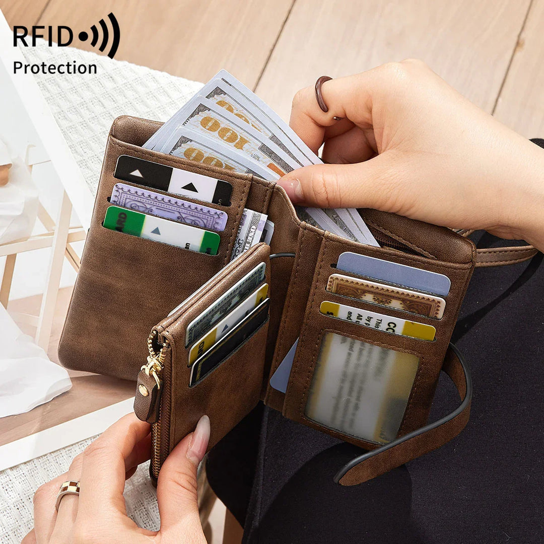 Brown leather RFID protection wallet open showing credit cards and hundred-dollar bills