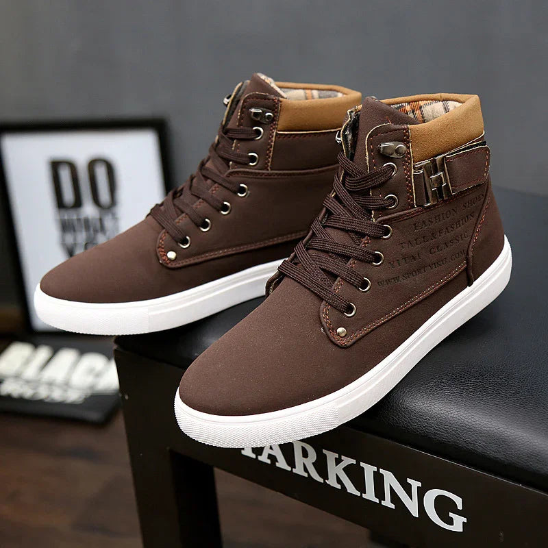 Brown high-top casual sneakers with white soles on a black surface, featuring lace-up design and padded collar