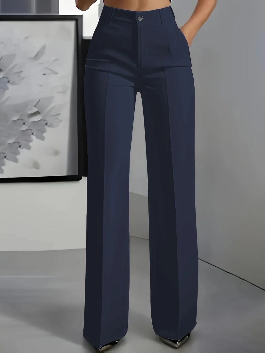 High-waisted navy blue wide-leg trousers with front pleats and button closure