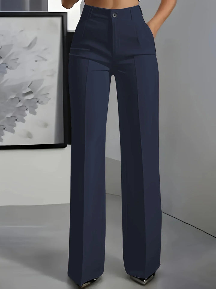 High-waisted navy blue wide-leg trousers with front pleats and button closure