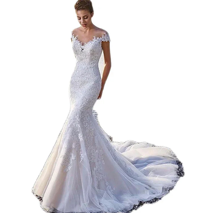 Elegant off-shoulder white lace mermaid wedding dress with long tulle train