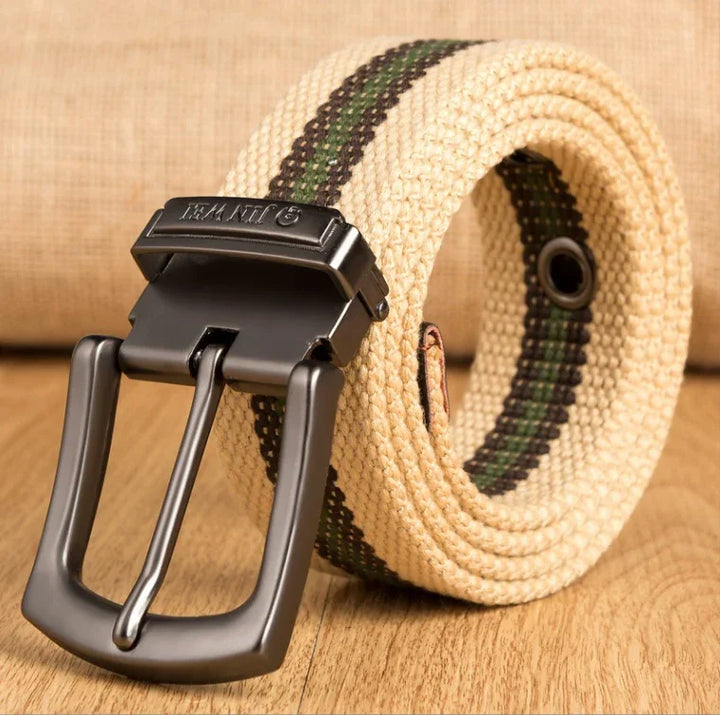 Beige woven fabric belt with green and black stripes and black metal buckle on wooden surface