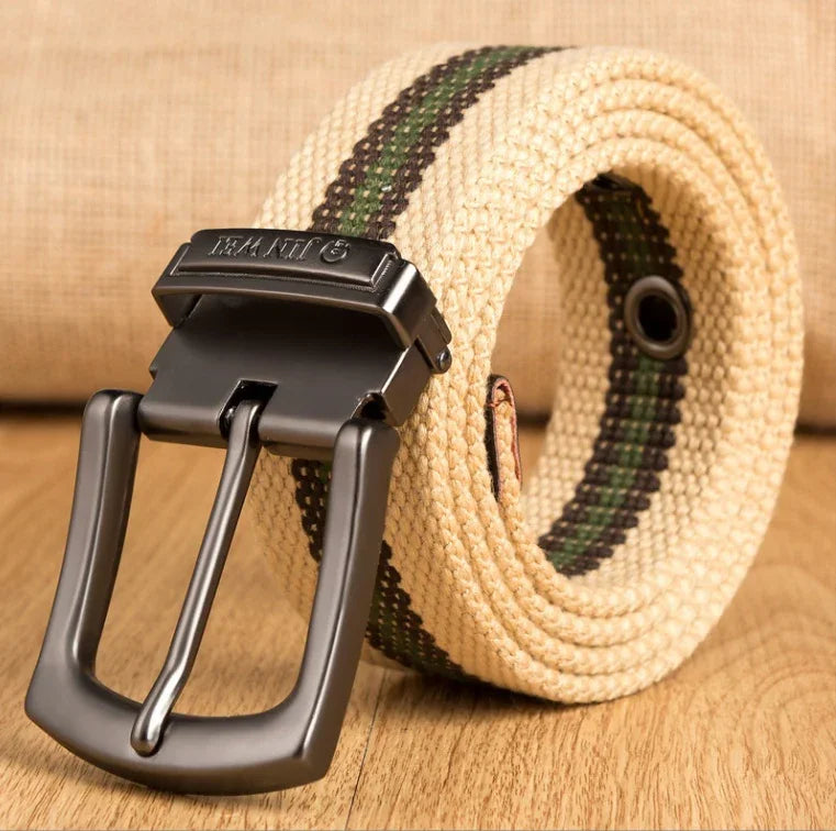Beige woven fabric belt with black and green stripes and black metallic buckle on wooden surface