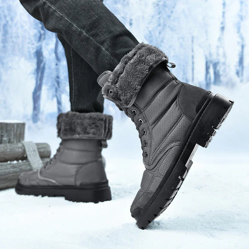 Gray winter boots with fur lining worn with black jeans in snowy outdoor setting