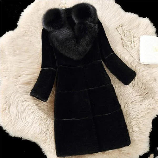 Elegant black fur coat with large fluffy collar, displayed on soft cream rug with pearl necklace