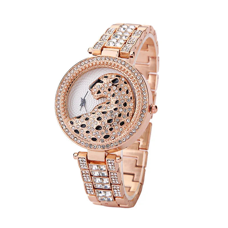 rose gold wristwatch with crystal-studded leopard design and rhinestone bracelet