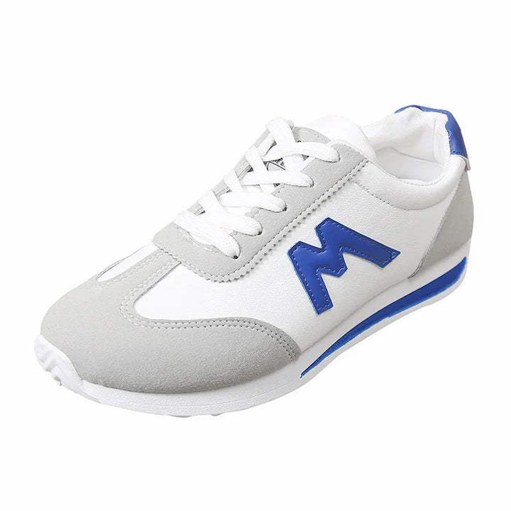 White and grey casual sneaker with blue accent and zigzag logo on side, white laces