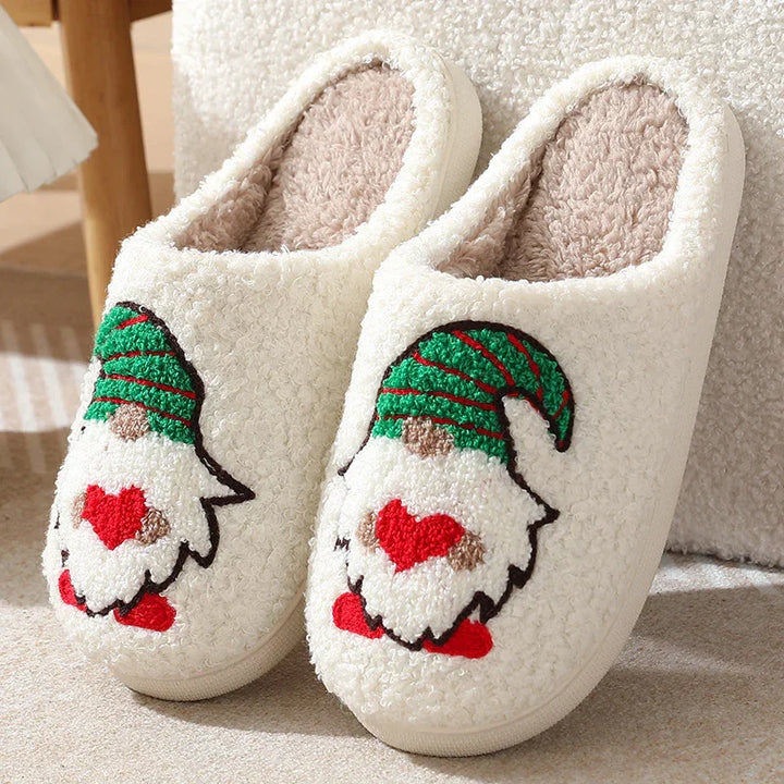 Cozy white fleece slippers with cute gnome design wearing green hat and red heart shoes