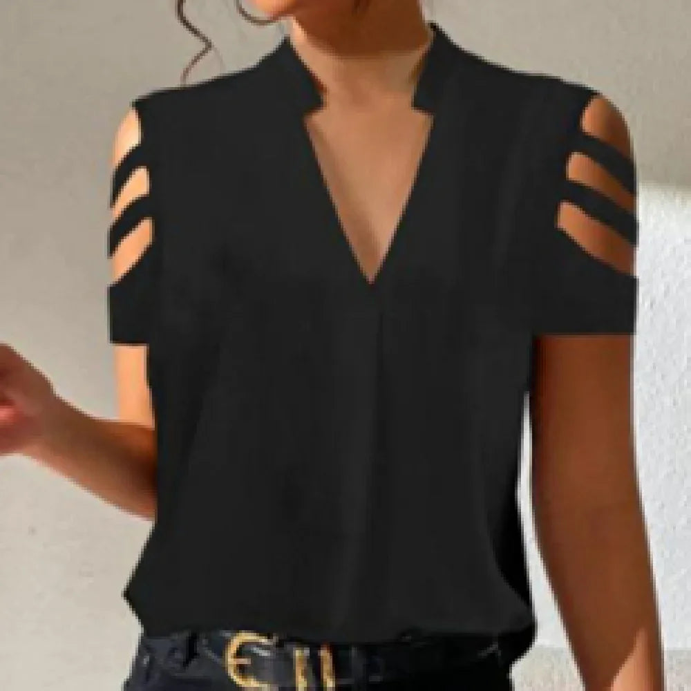 Woman wearing black cold shoulder top with V-neck and triple strap sleeve detail