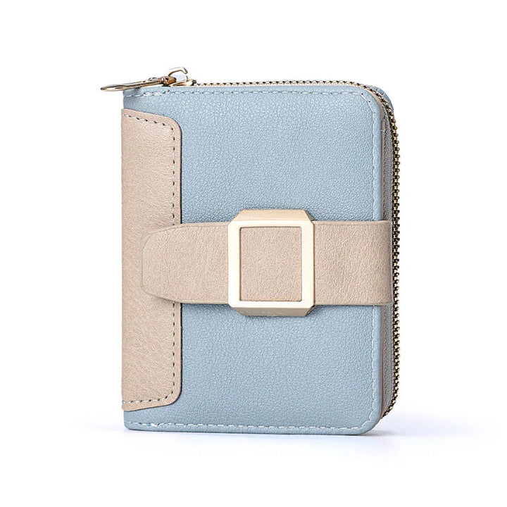 Compact blue and beige leather wallet with gold-tone buckle and zipper closure