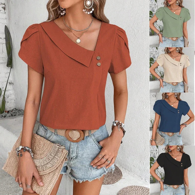 Woman wearing stylish asymmetrical brown top with buttons and puff sleeves paired with denim shorts
