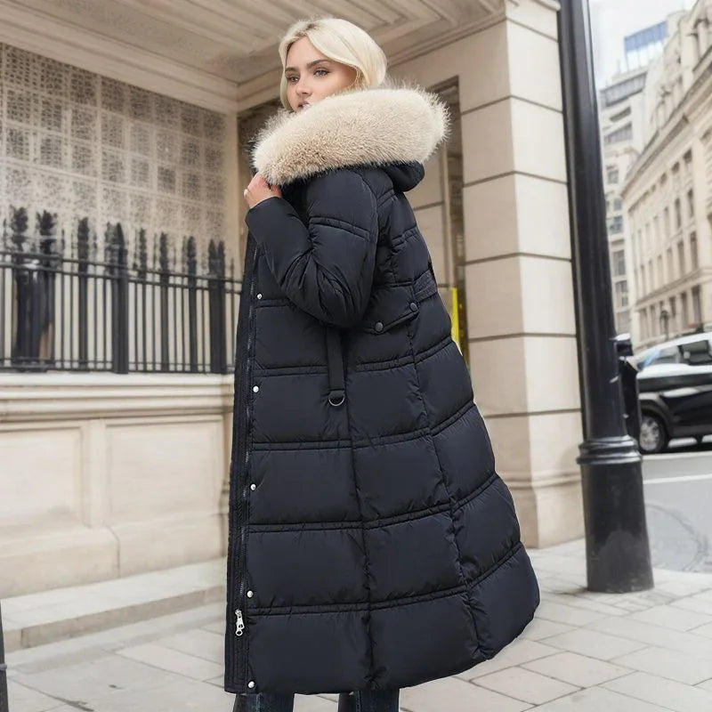 Blonde woman wearing long black puffer coat with large beige fur collar in urban street setting