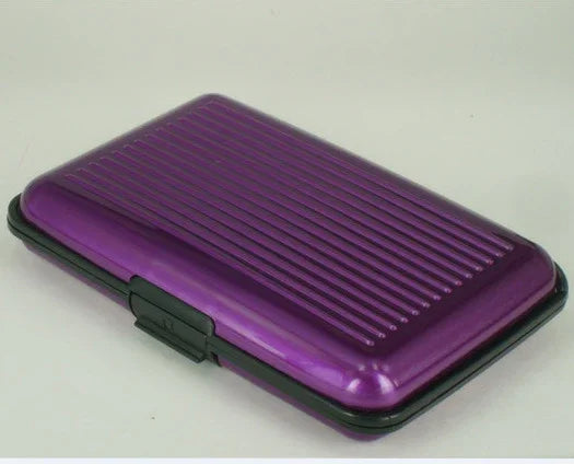 Compact purple hard shell wallet case with black trim and textured surface