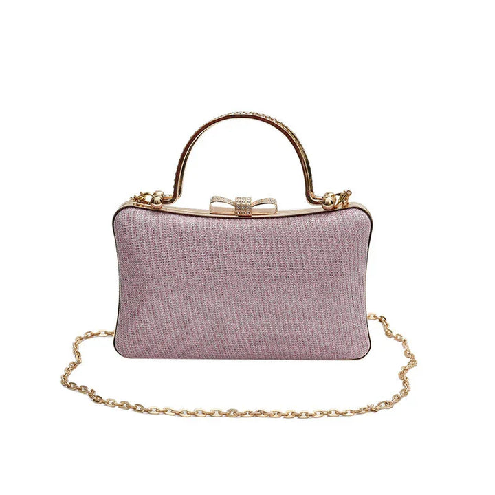 Elegant pink textured evening clutch bag with gold handle, bow clasp, and gold chain strap