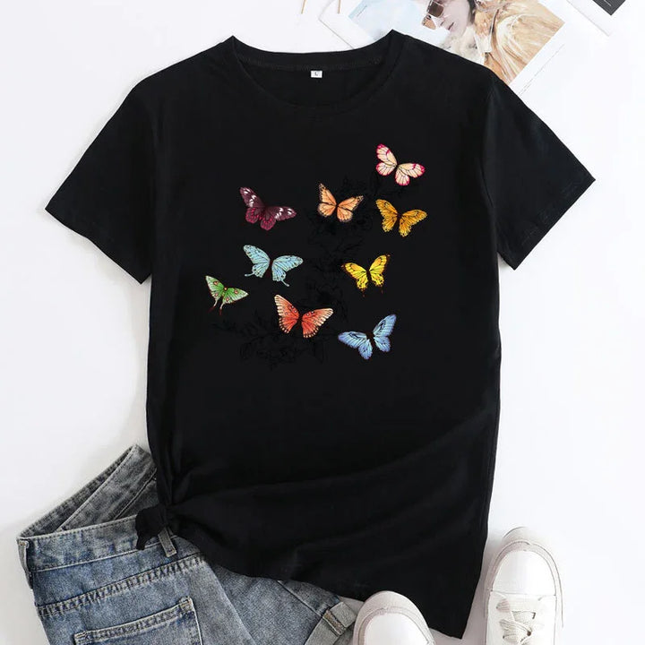 Black t-shirt with colorful butterfly print paired with denim jeans and white sneakers
