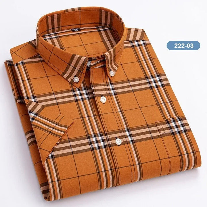 Folded orange plaid button-down shirt with short sleeves and front pocket
