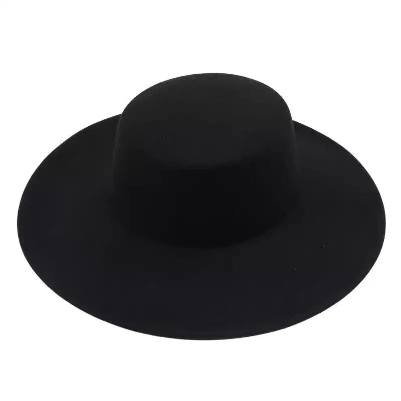 Black wide-brimmed felt hat with flat crown on white background