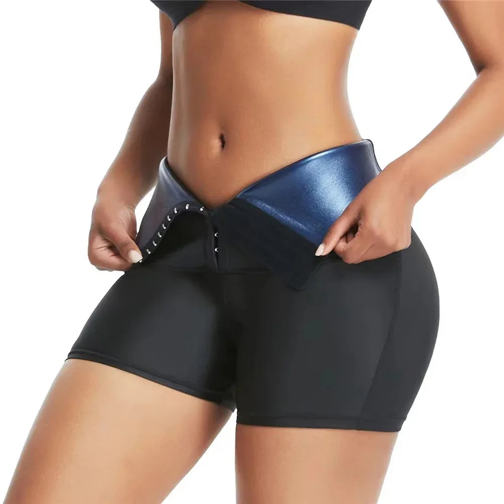 Close-up of woman wearing black compression shorts and blue waist trainer belt with hook closure