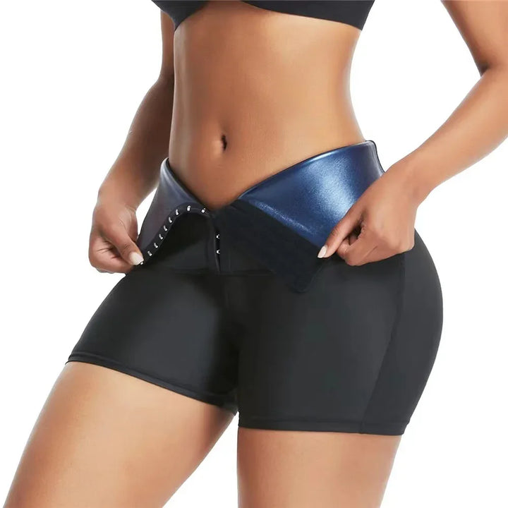 Close-up of woman wearing black compression shorts and blue waist trainer belt with hook closure