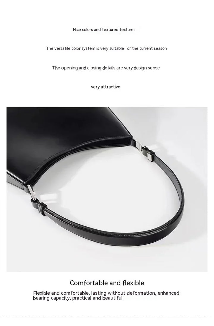 Black leather handbag strap with silver buckle on white background, flexible and comfortable design