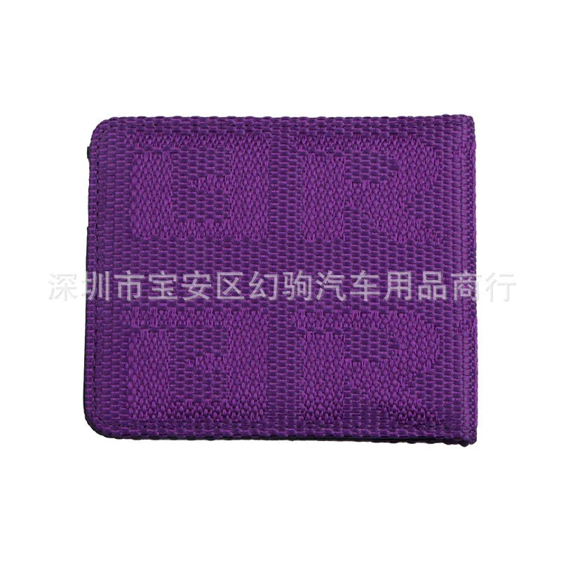 Purple woven fabric patch with the text 'TUR TUR' embossed on it