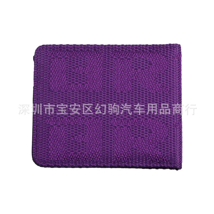 Purple woven fabric patch with the text 'TUR TUR' embossed on it