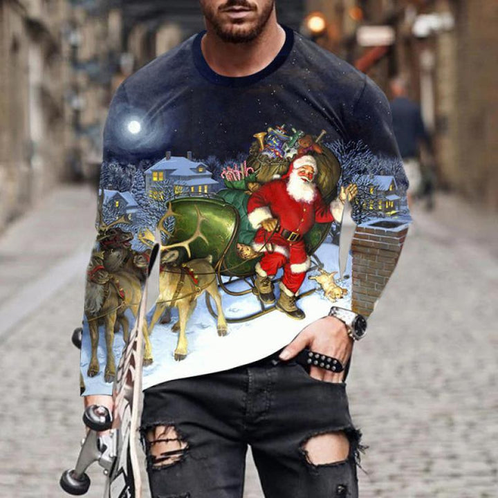 Christmas sweatshirt featuring Santa with reindeer and sleigh in snowy village at night