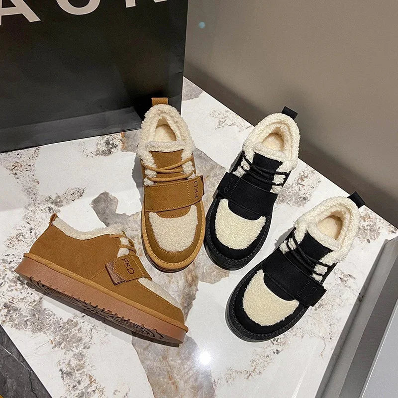 Cozy winter sneakers with fleece lining in brown and black, displayed on marble floor