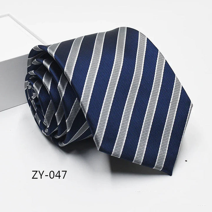 Rolled navy blue tie with diagonal silver stripes on white background labeled ZY-047