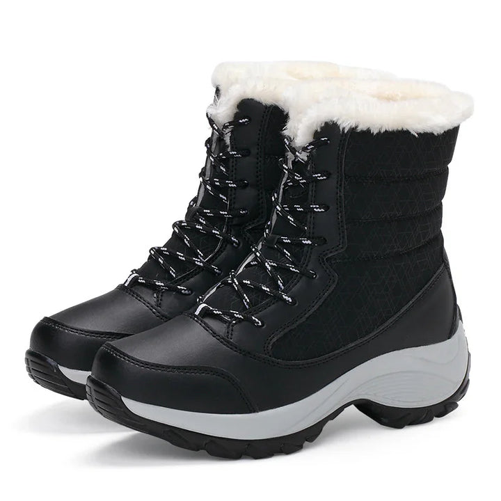 Black insulated winter boots with white faux fur lining and thick rubber soles