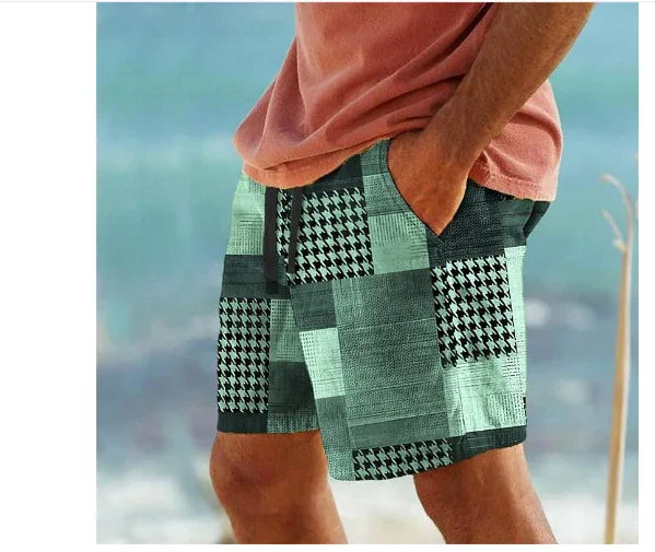 Man wearing green and black patterned patchwork shorts with hands in pockets, posing outdoors