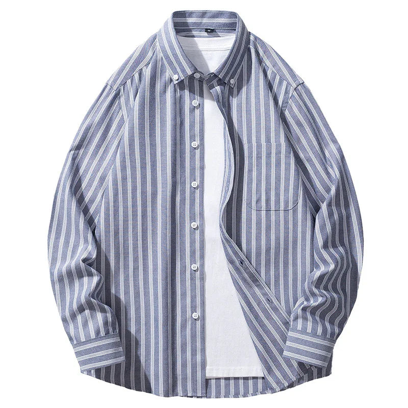 Blue and white vertical striped button-up shirt layered over plain white t-shirt