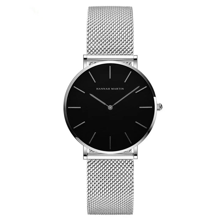 Minimalist Hannah Martin wristwatch with black dial and silver mesh strap