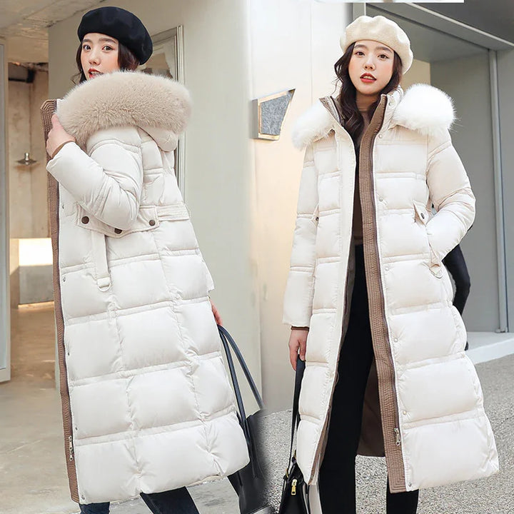 Two women wearing long white puffer coats with fur collars and berets in an urban setting