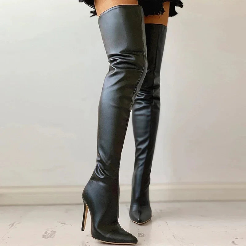 Black leather thigh-high stiletto boots with pointed toes on a marble floor